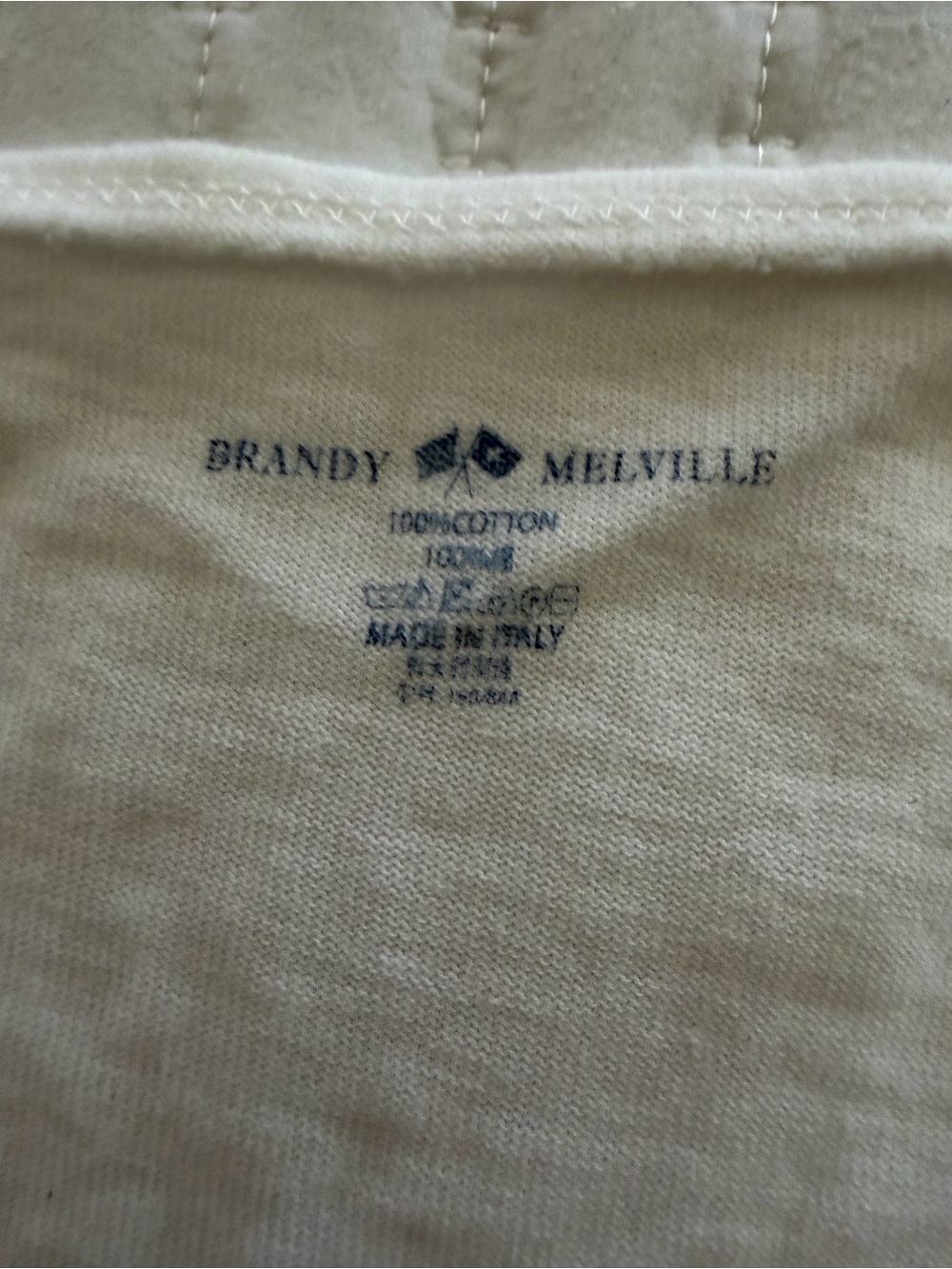 Brandy Melville Men's Off-White Cotton Crew Tee with Navy Logo